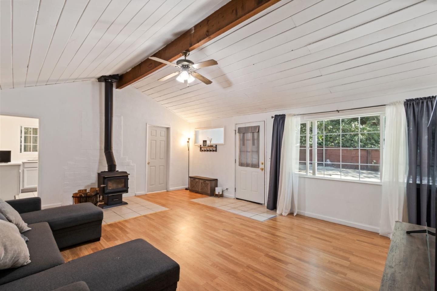 320 Fireside Road Boulder Creek, CA 95006 - Photo 7 of 36 a living room with furniture window and wooden floor