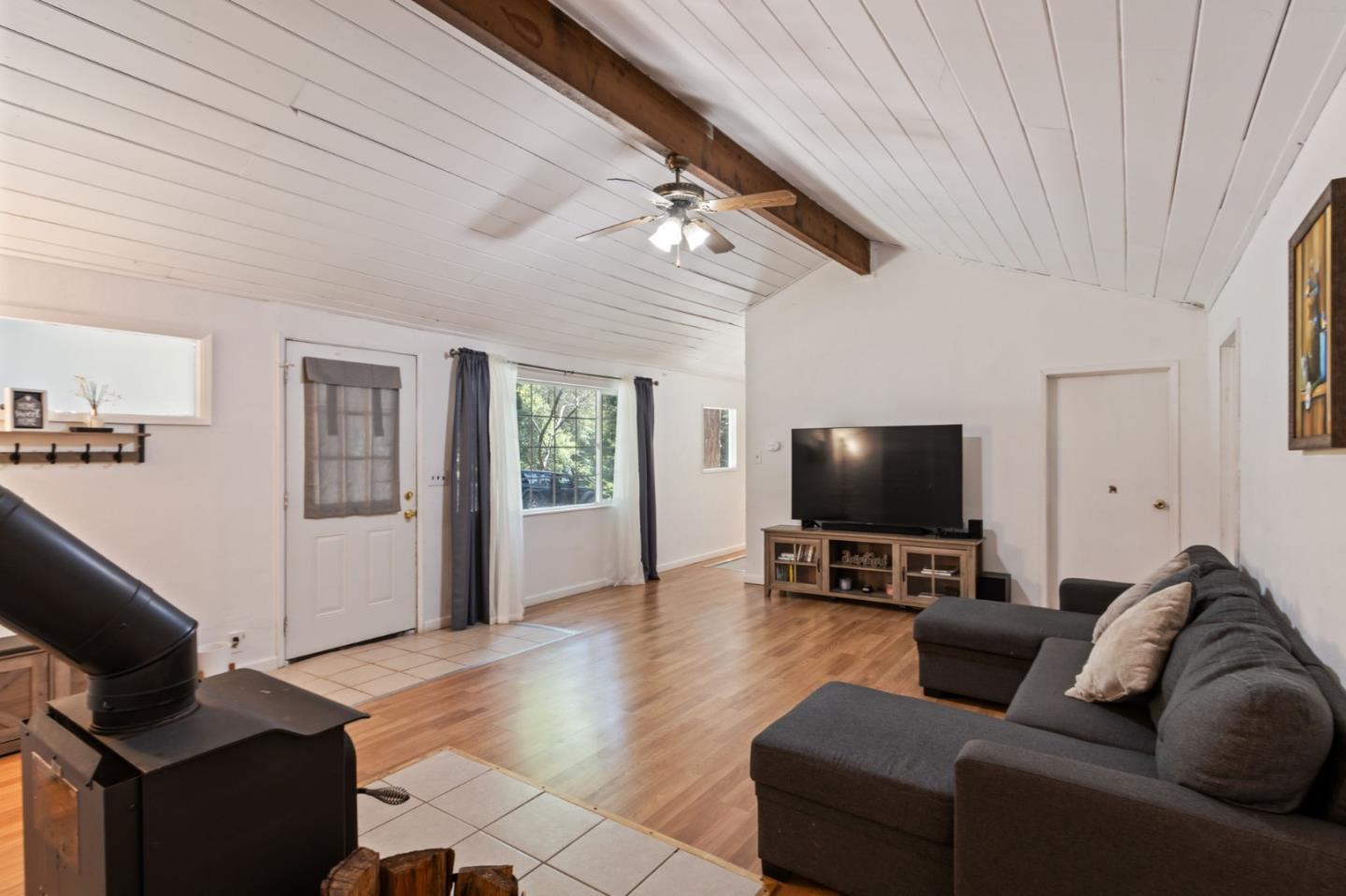 320 Fireside Road Boulder Creek, CA 95006 - Photo 9 of 36 a living room with furniture and a flat screen tv