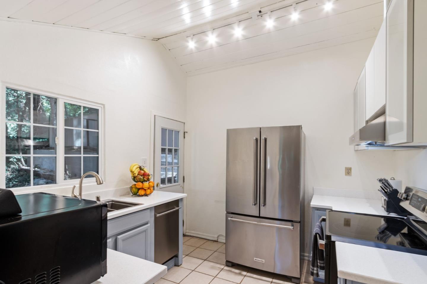 320 Fireside Road Boulder Creek, CA 95006 - Photo 10 of 36 a kitchen with stainless steel appliances granite countertop a refrigerator a sink a stove and a refrigerator