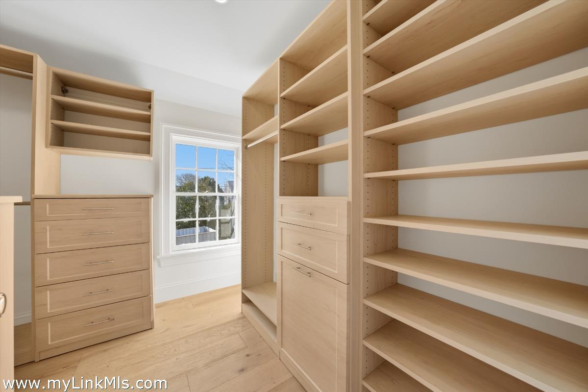 85 Orange Street Nantucket, MA 02554 - Photo 55 of 89 a view of walk in closet with empty racks