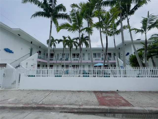 a view of building with palm tree