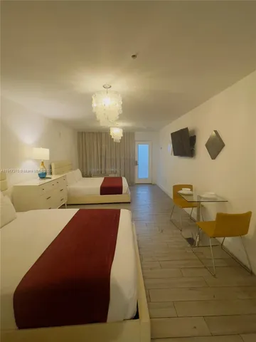 a lobby with furniture and rug