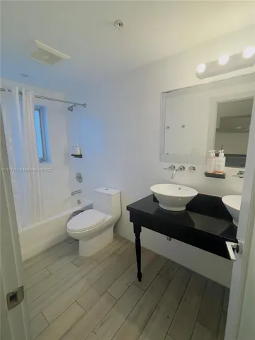 a view of a bathroom sink and a toilet