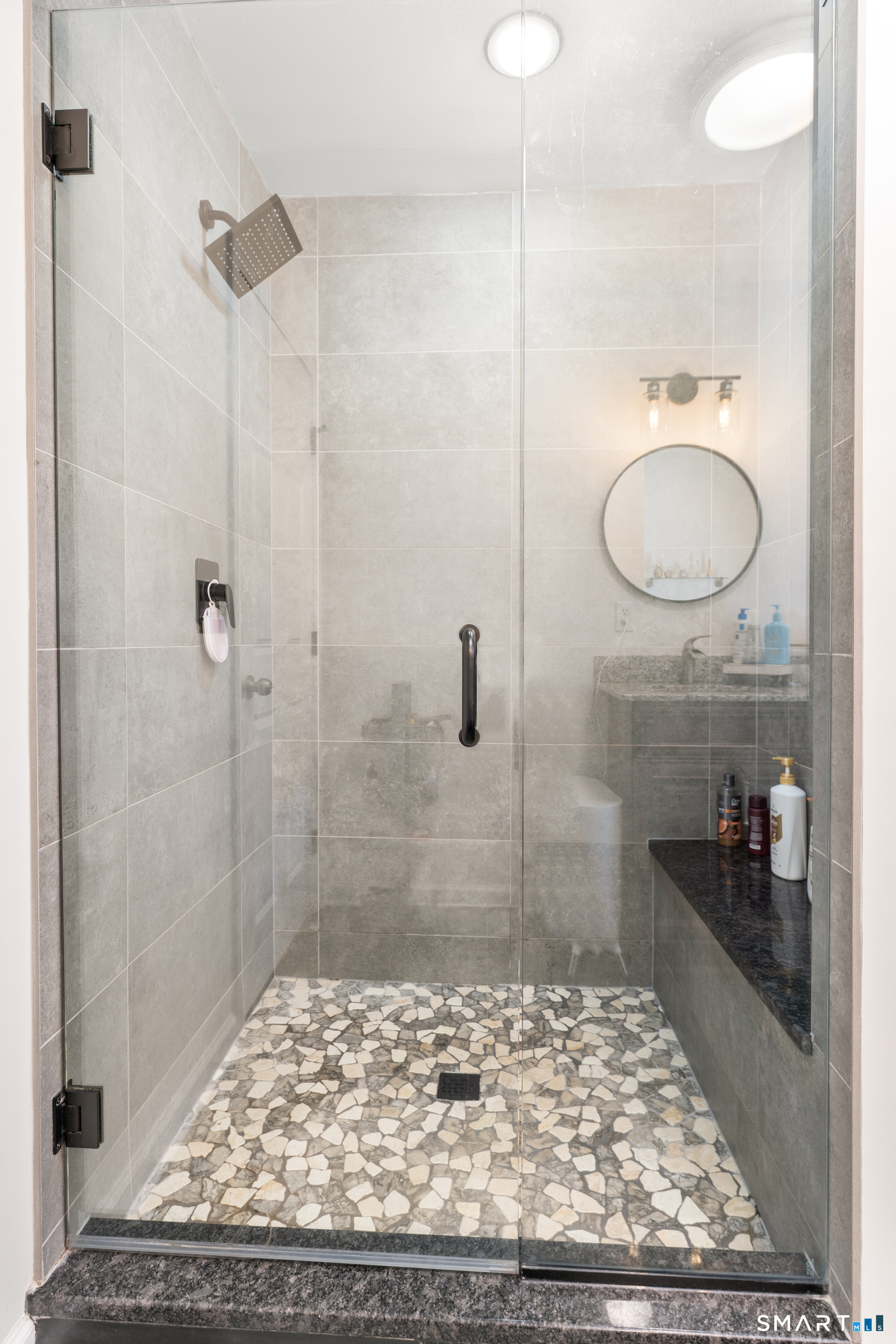 261 Spring Road North Haven, CT 06473 - Photo 30 of 39 a bathroom with a granite countertop sink a toilet and shower