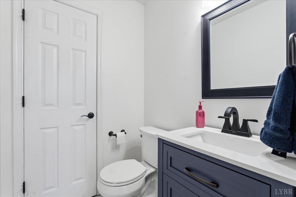1329 Jeb Stuart Place Forest, VA 24551 - Photo 14 of 60 a bathroom with a granite countertop sink toilet and shower