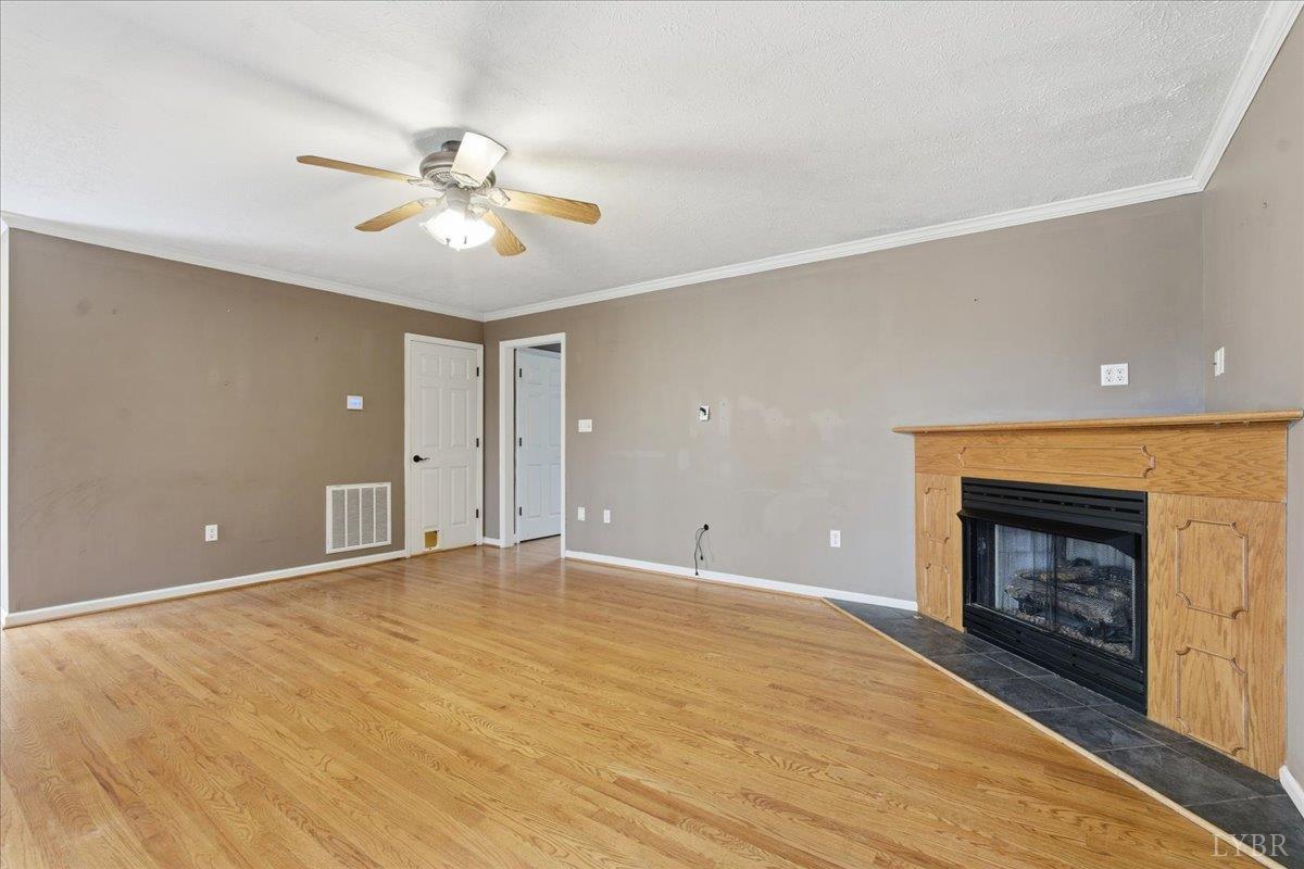1329 Jeb Stuart Place Forest, VA 24551 - Photo 16 of 60 an empty room with windows and fireplace