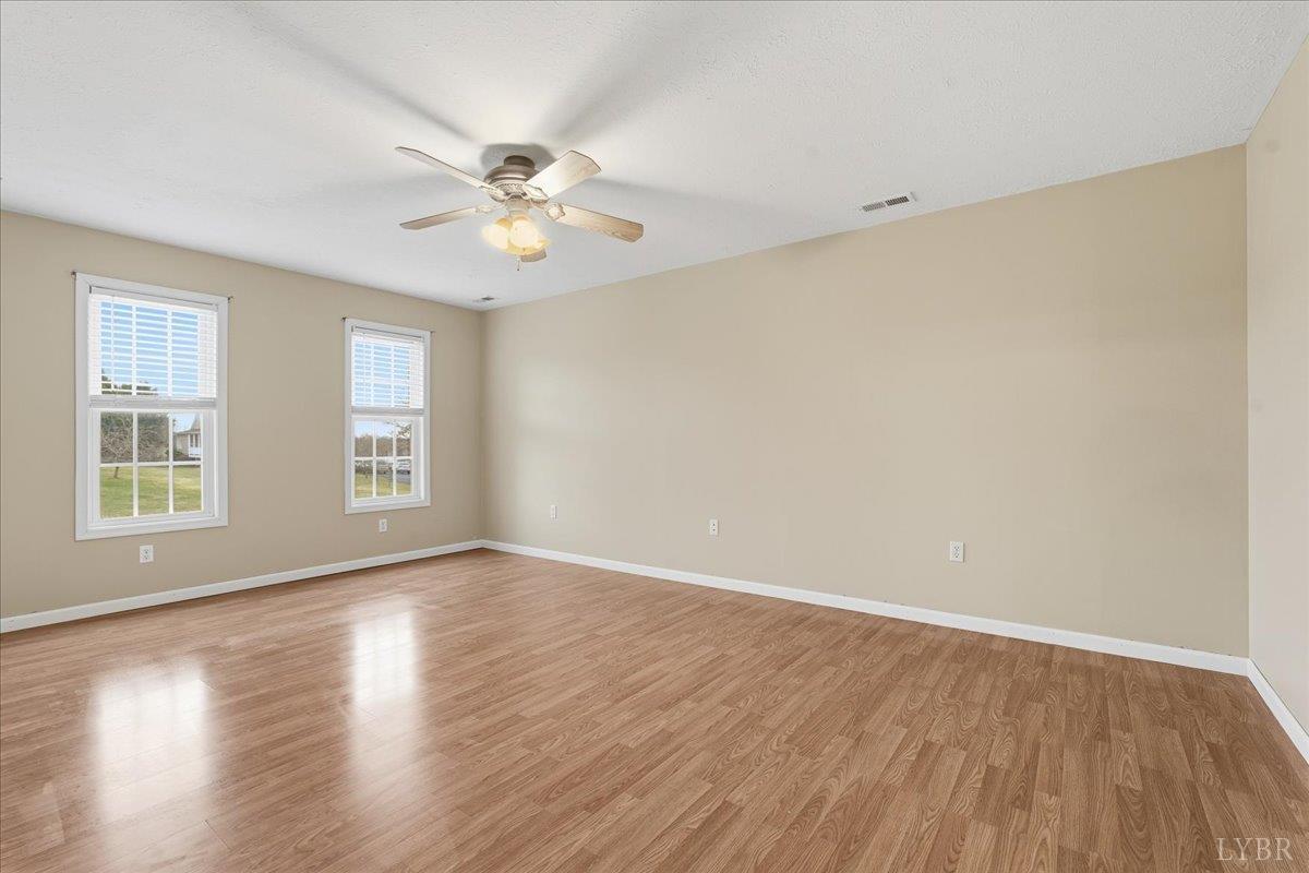 1329 Jeb Stuart Place Forest, VA 24551 - Photo 23 of 60 wooden floor in an empty room with a window