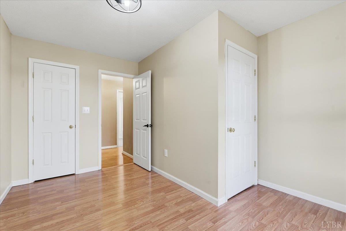 1329 Jeb Stuart Place Forest, VA 24551 - Photo 31 of 60 a view of an empty room with wooden floor and window