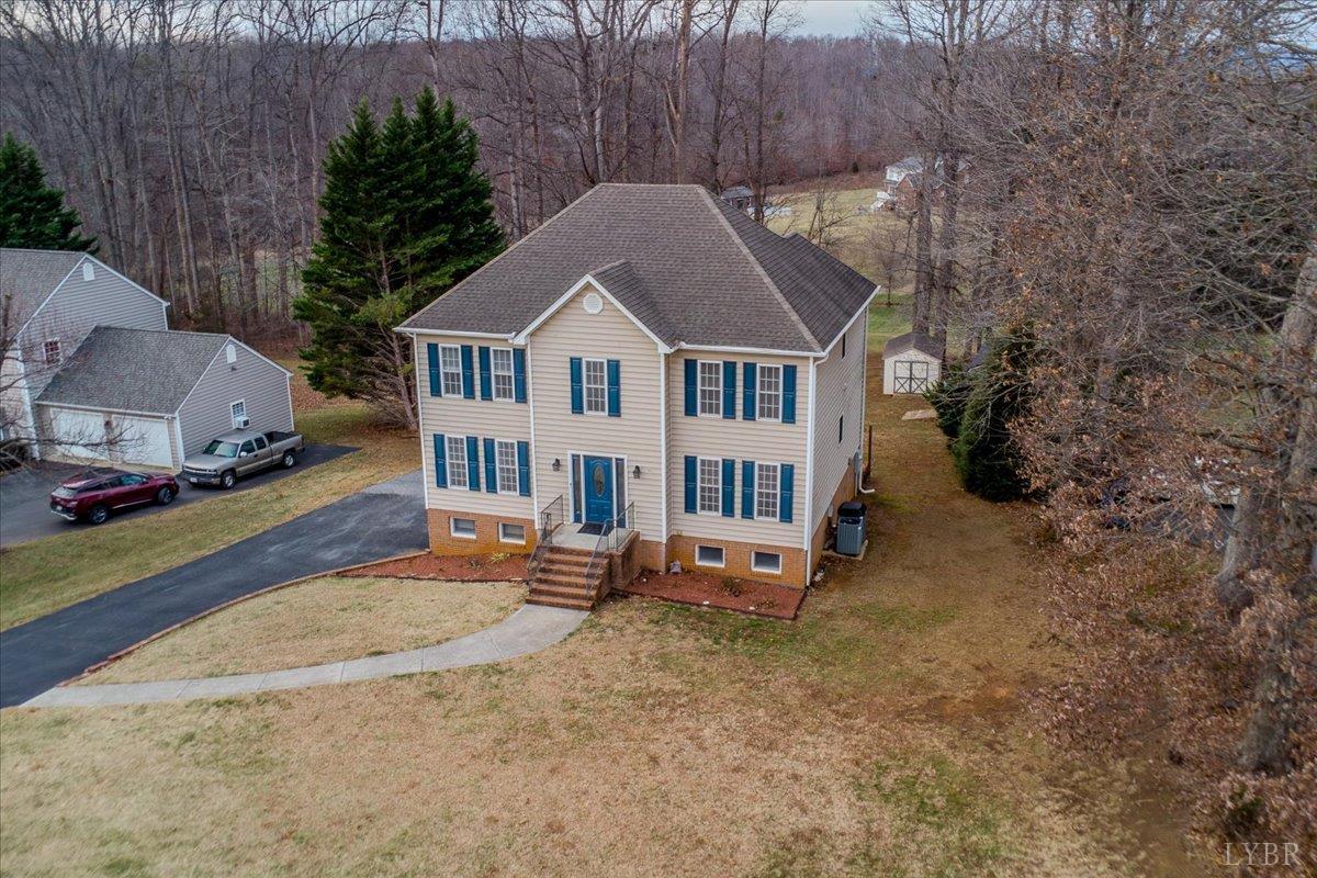 1329 Jeb Stuart Place Forest, VA 24551 - Photo 55 of 60 a front view of a house with a yard and garage