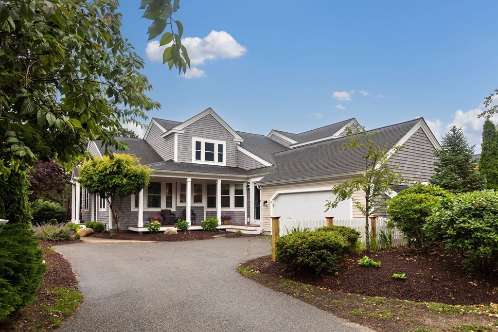 front view of a house with a garden