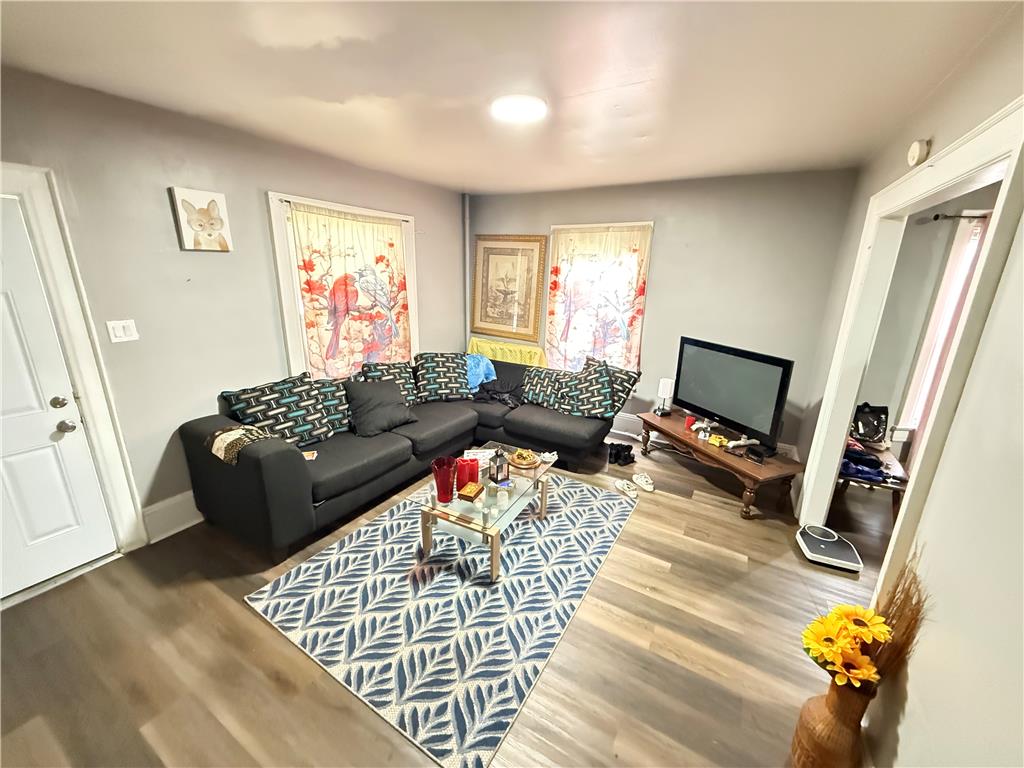 700 Philo Street Scranton, PA 18508 - Photo 5 of 19 Natural light illuminates this cozy living space with easy-care wood-look flooring.