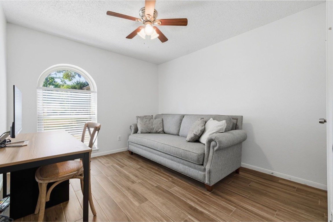 17522 Hunters Glen Circle Humble, TX 77396 - Photo 11 of 14 a living room with a couch and a table