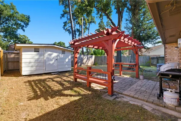a view of a backyard with a sitting area