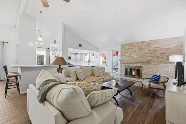a living room with furniture and a fireplace