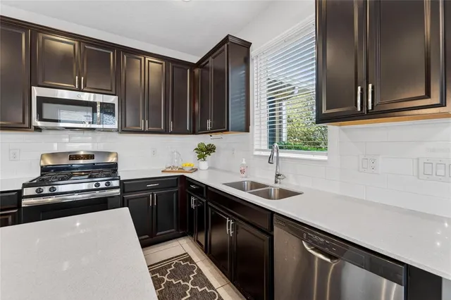 a bathroom with a double vanity sink a and a mirror