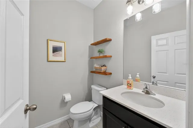 a view of a house with brick walls and a yard with plants