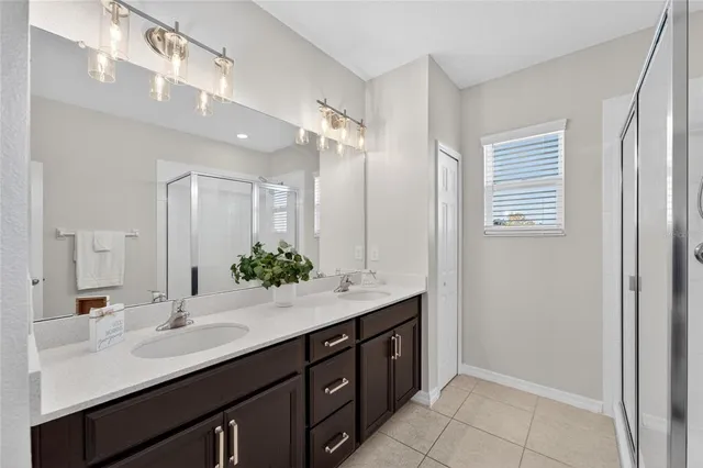 an aerial view of a house with a swimming pool