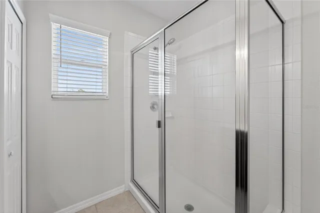 an aerial view of a house with a ocean view