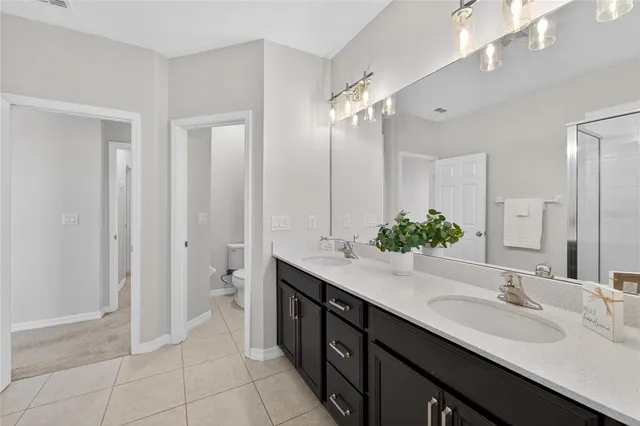 an aerial view of a house with a lake view