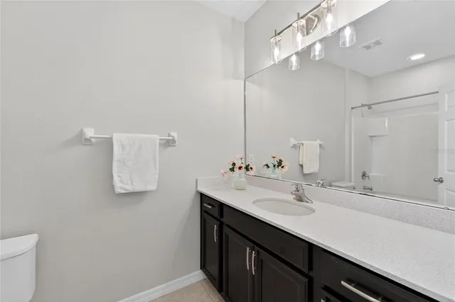 an aerial view of a house with a lake view