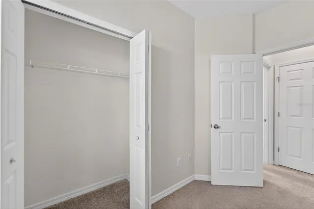 an aerial view of residential houses with outdoor space and lake view