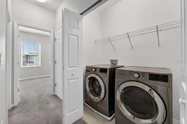 an aerial view of a house with a swimming pool