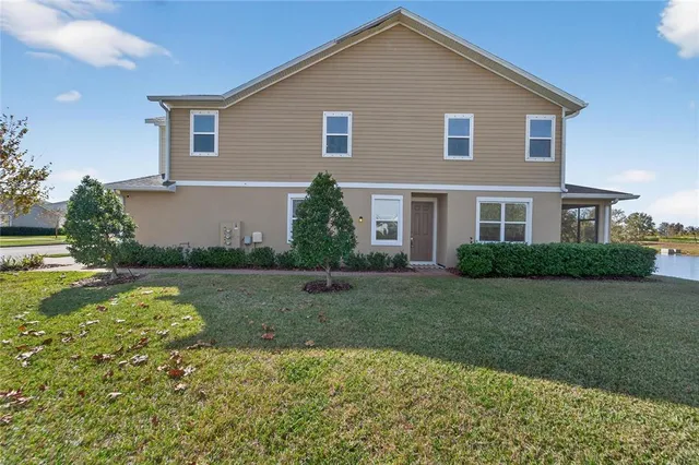 a living room with furniture and painting on the wall