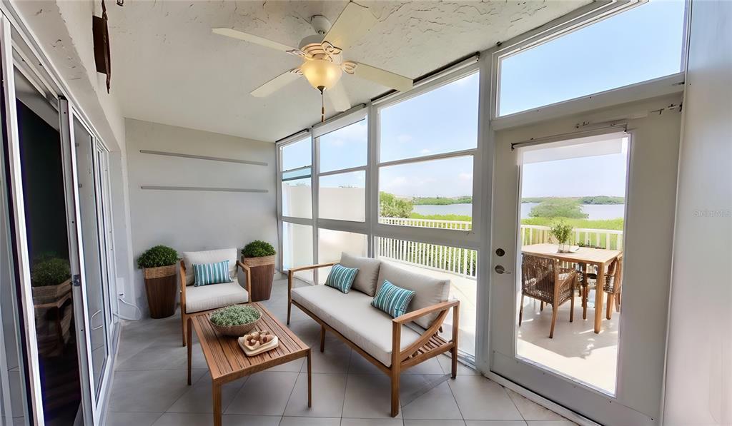 6495 Shoreline Drive, Unit 8104 St. Petersburg, FL 33708 - Photo 13 of 70 a living room with furniture and a window