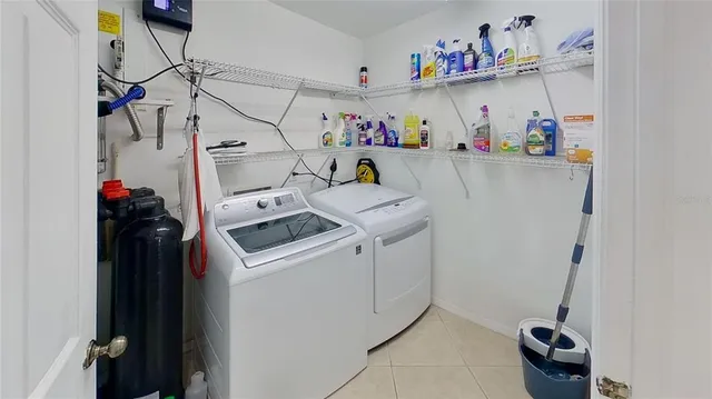 a utility room with dryer and washer