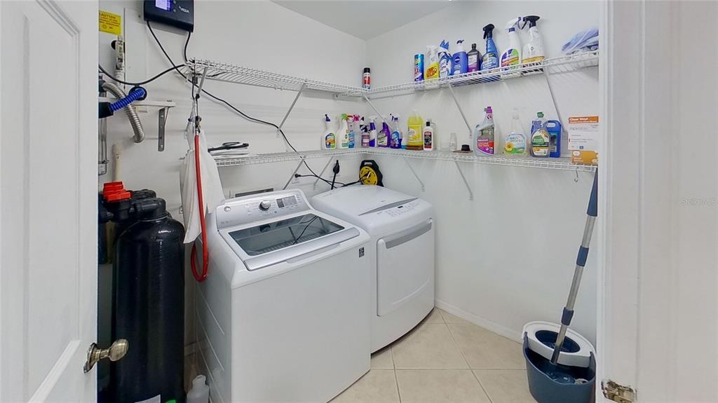 6495 Shoreline Drive, Unit 8104 St. Petersburg, FL 33708 - Photo 15 of 70 a utility room with dryer and washer