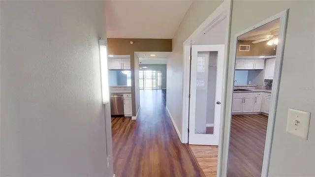 a kitchen with stainless steel appliances a stove a sink and a refrigerator
