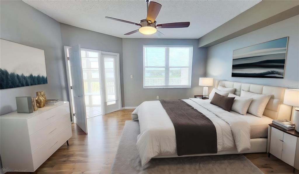 6495 Shoreline Drive, Unit 8104 St. Petersburg, FL 33708 - Photo 4 of 70 a bedroom with bed tv and window