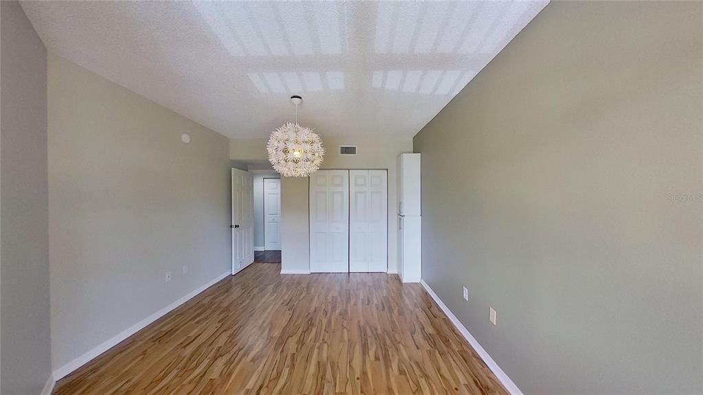 6495 Shoreline Drive, Unit 8104 St. Petersburg, FL 33708 - Photo 48 of 70 a view of a hallway with wooden floor