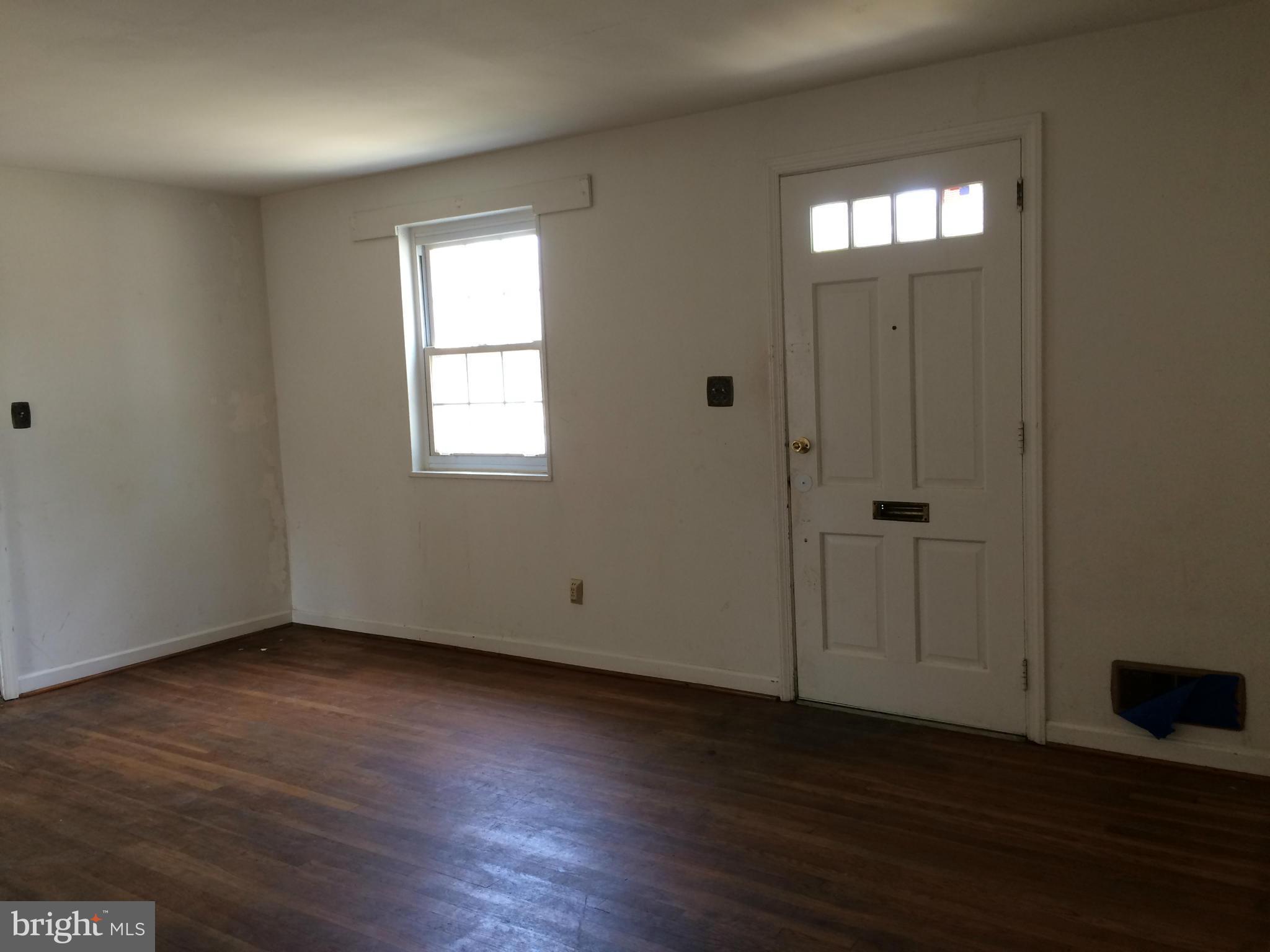 3704 Fairly Street Silver Spring, MD 20906 - Photo 3 of 24 an empty room with wooden floor and windows