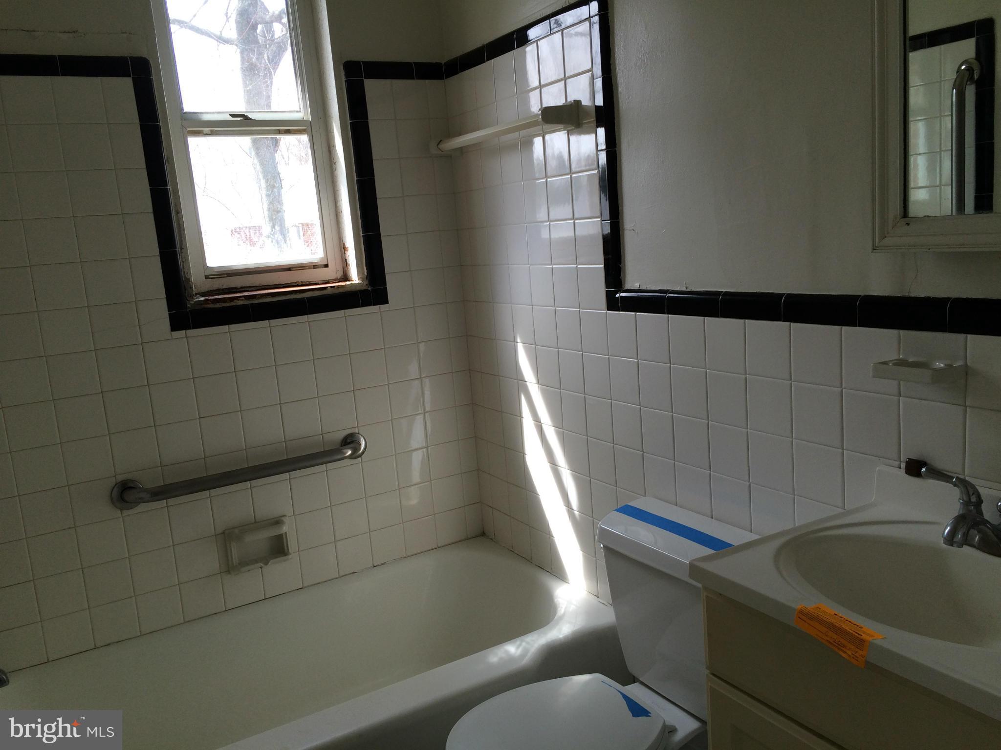 3704 Fairly Street Silver Spring, MD 20906 - Photo 8 of 24 a bathroom with a sink a toilet and bathtub