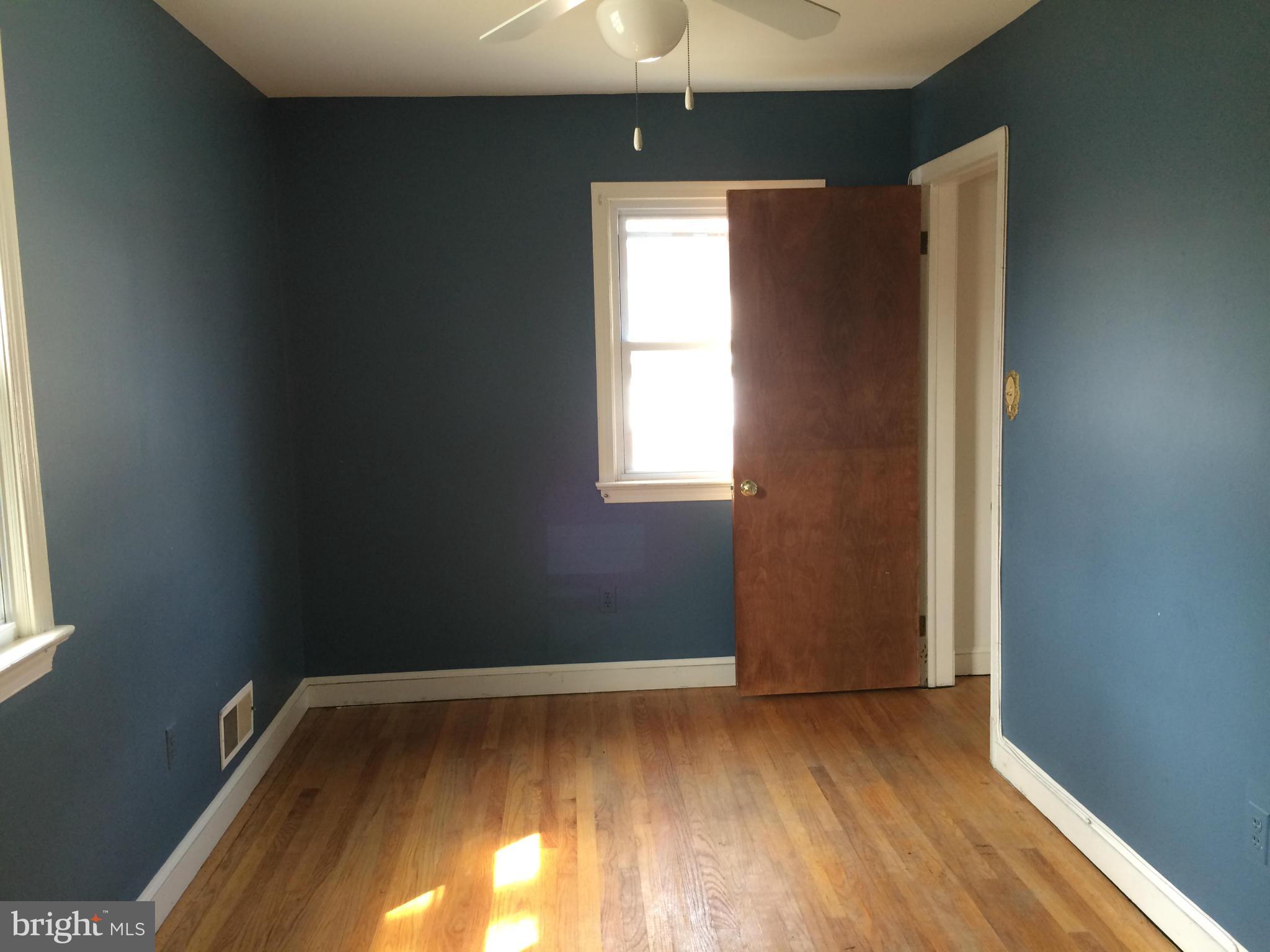 3704 Fairly Street Silver Spring, MD 20906 - Photo 10 of 24 an empty room with wooden floor and windows