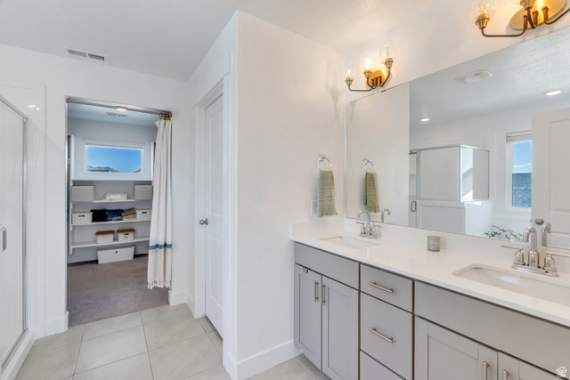 646 South Meade Street Mapleton, UT 84664 - Photo 24 of 46 Dual vanity with light gray cabinetry, chrome hardware, undermount sinks, and white countertops