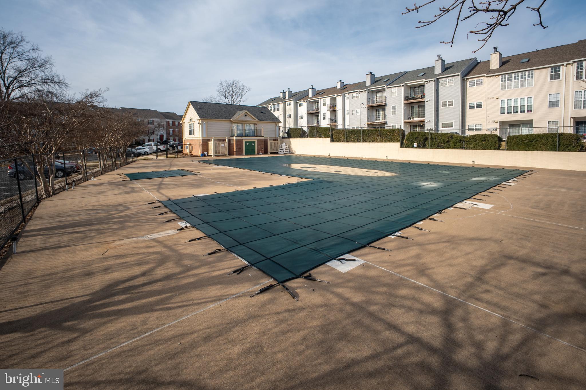 107 Fort Evans Road Southeast, Unit B Leesburg, VA 20176 - Photo 18 of 21 a view of an house with swimming pool