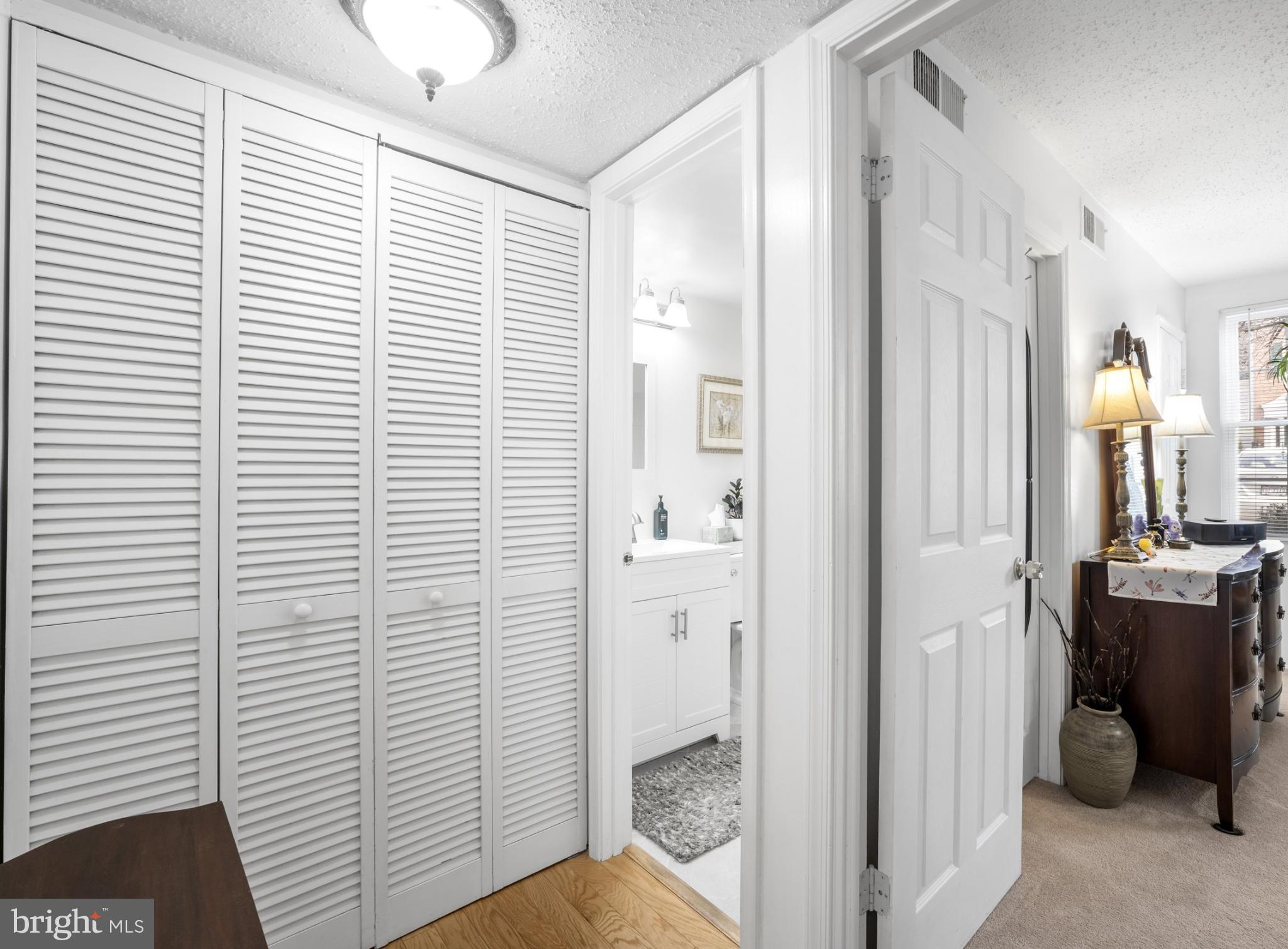 107 Fort Evans Road Southeast, Unit B Leesburg, VA 20176 - Photo 10 of 21 a view of a hallway with bathroom and shower