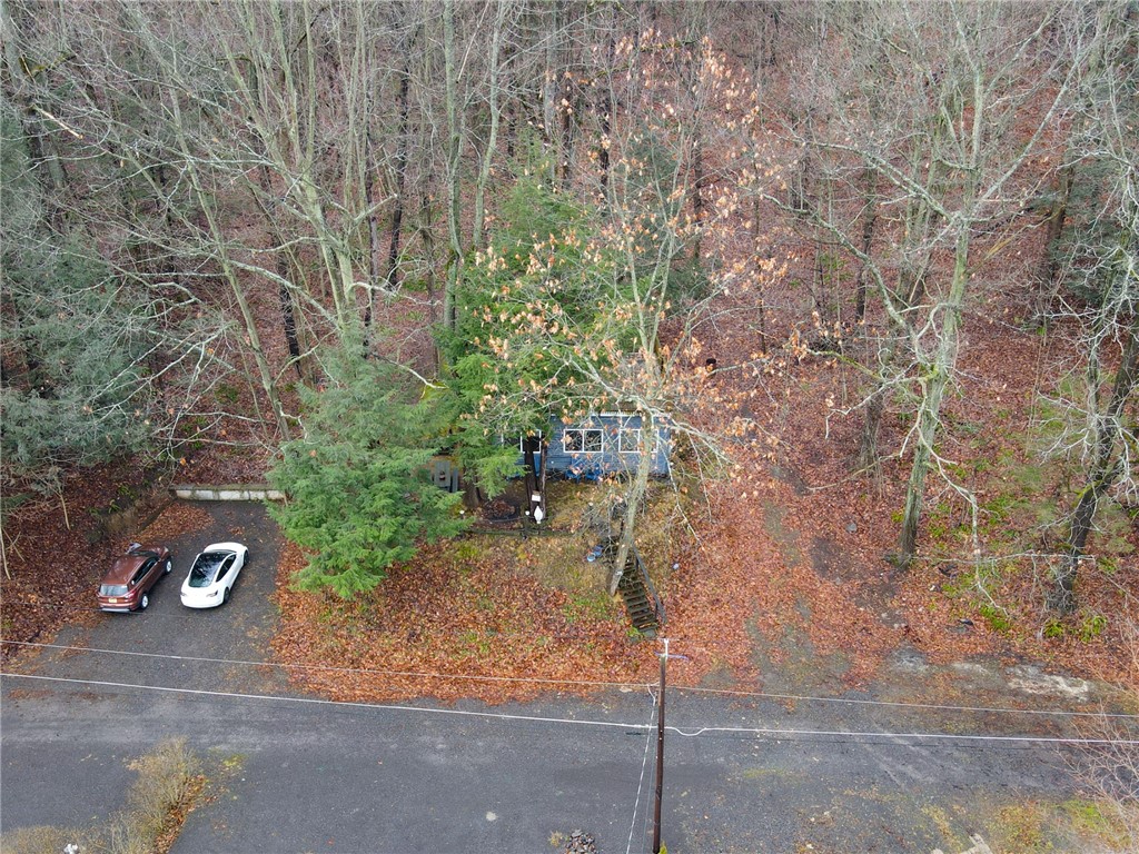 8017 North Maple Road Wolcott, NY 14590 - Photo 1 of 1 Tucked away amongst the trees - such a peaceful se