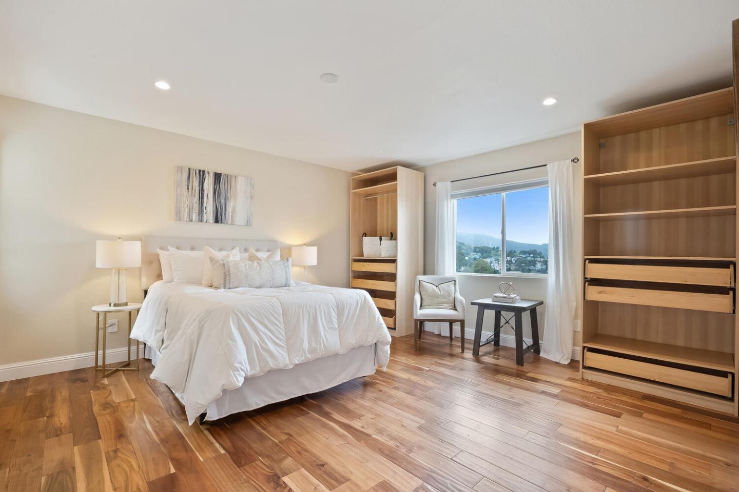 1100 Humboldt Road Brisbane, CA 94005 - Photo 13 of 37 a bedroom with a bed and wooden floor
