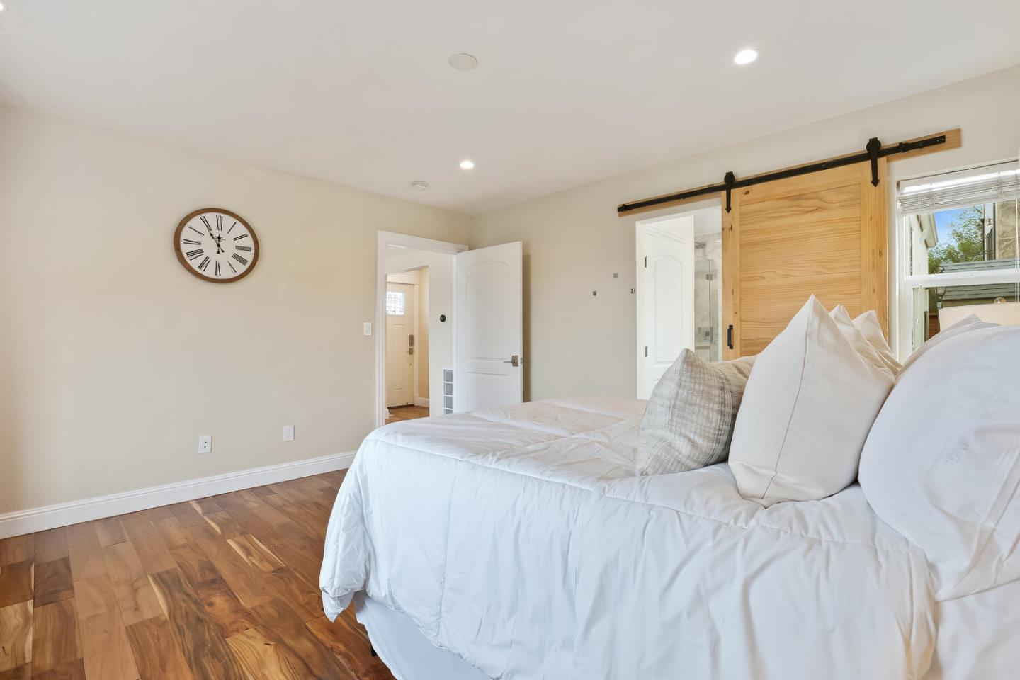 1100 Humboldt Road Brisbane, CA 94005 - Photo 14 of 37 a bedroom with a large bed and a large window