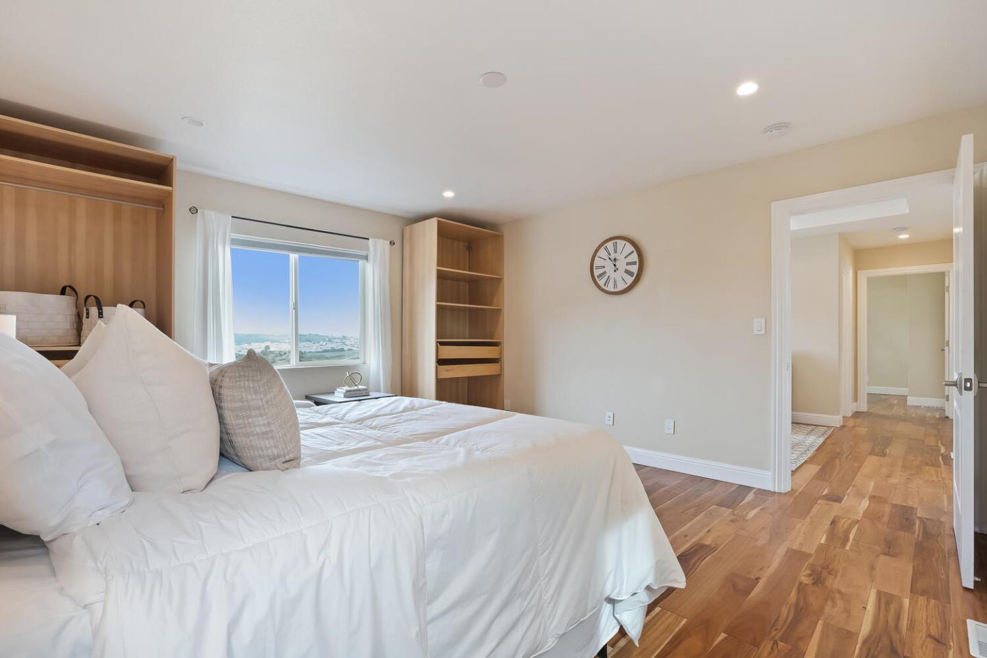 1100 Humboldt Road Brisbane, CA 94005 - Photo 15 of 37 a bedroom with a large bed and a closet