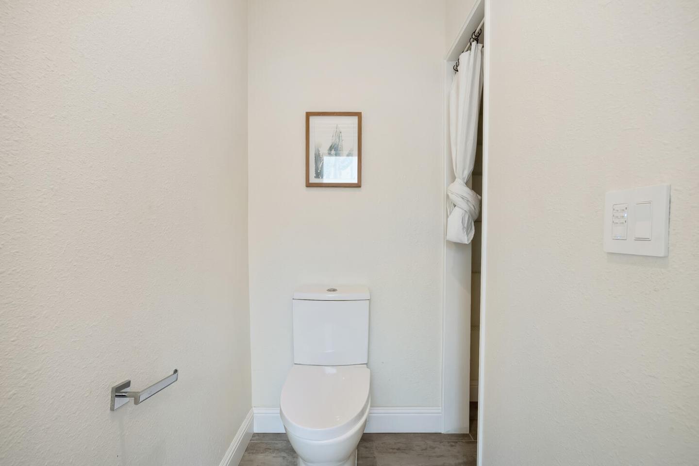 1100 Humboldt Road Brisbane, CA 94005 - Photo 19 of 37 a bathroom with a toilet and a sink