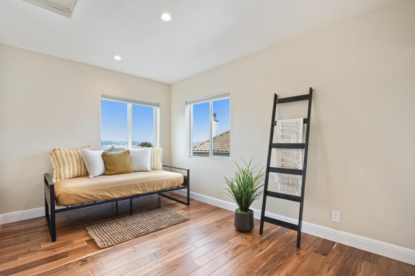 1100 Humboldt Road Brisbane, CA 94005 - Photo 21 of 37 a living room with furniture and wooden floor