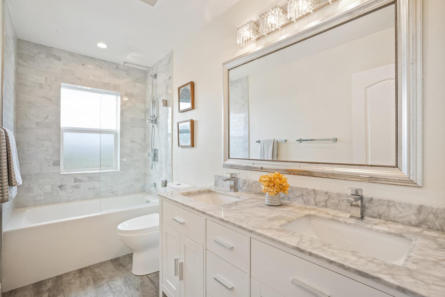 1100 Humboldt Road Brisbane, CA 94005 - Photo 23 of 37 a bathroom with a granite countertop sink toilet and shower