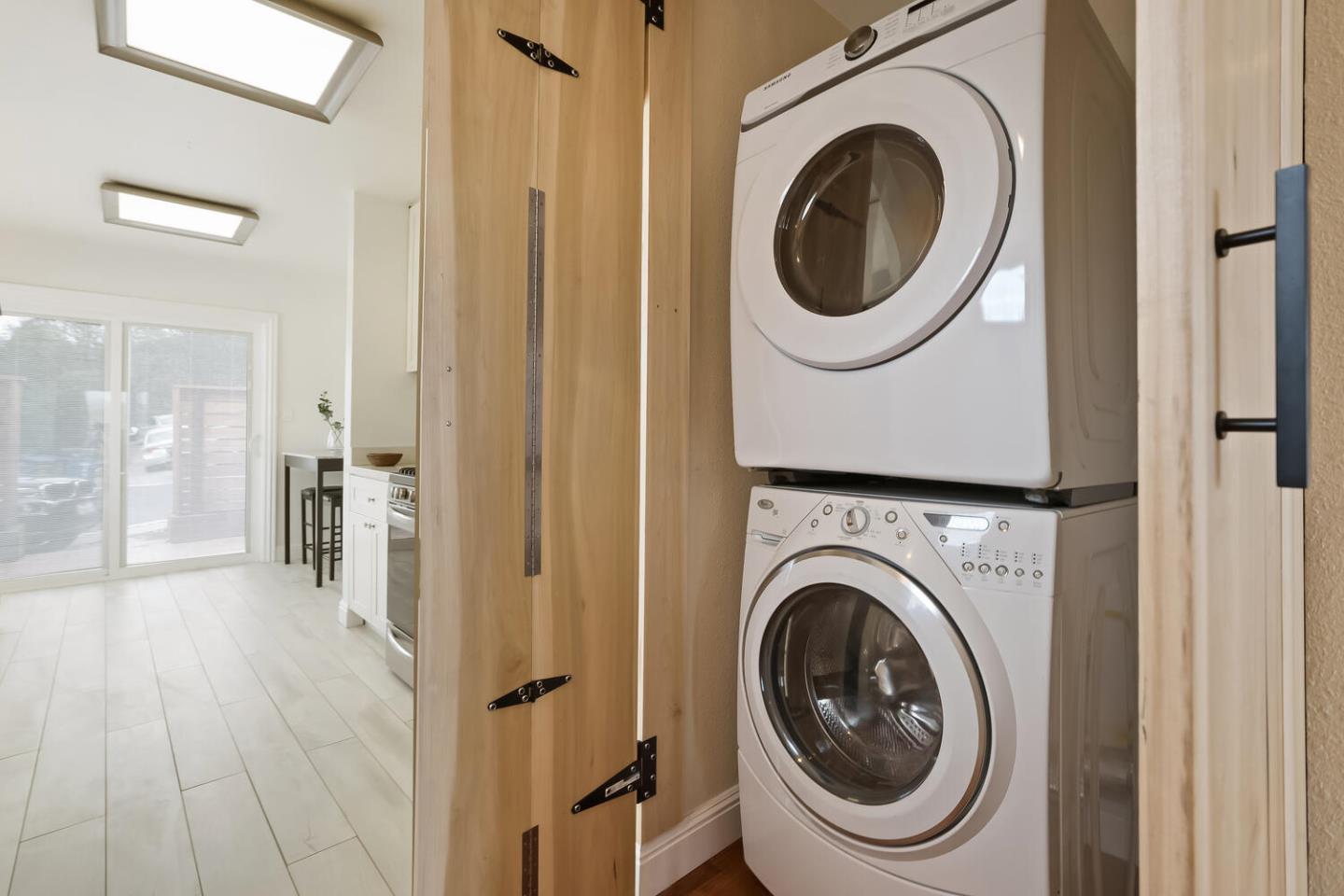 1100 Humboldt Road Brisbane, CA 94005 - Photo 24 of 37 a view of a hallway with washer and dryer