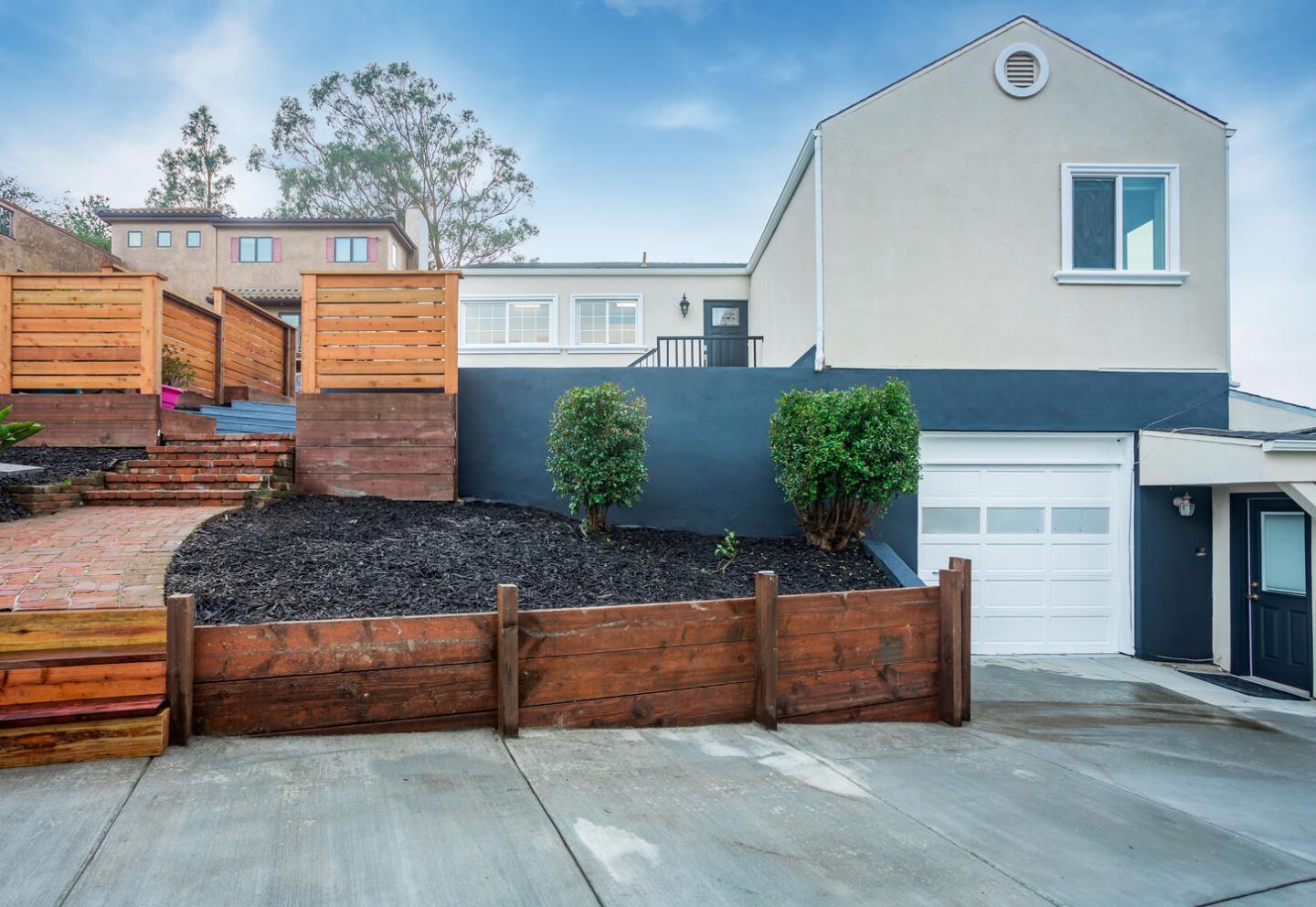 1100 Humboldt Road Brisbane, CA 94005 - Photo 25 of 37 a view of a house with a outdoor space