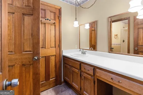 a bathroom with a double vanity sink and a mirror