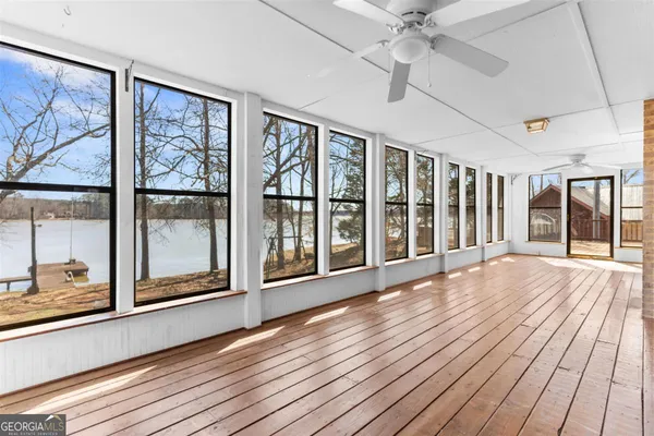 a view of a house with wooden floor and a window